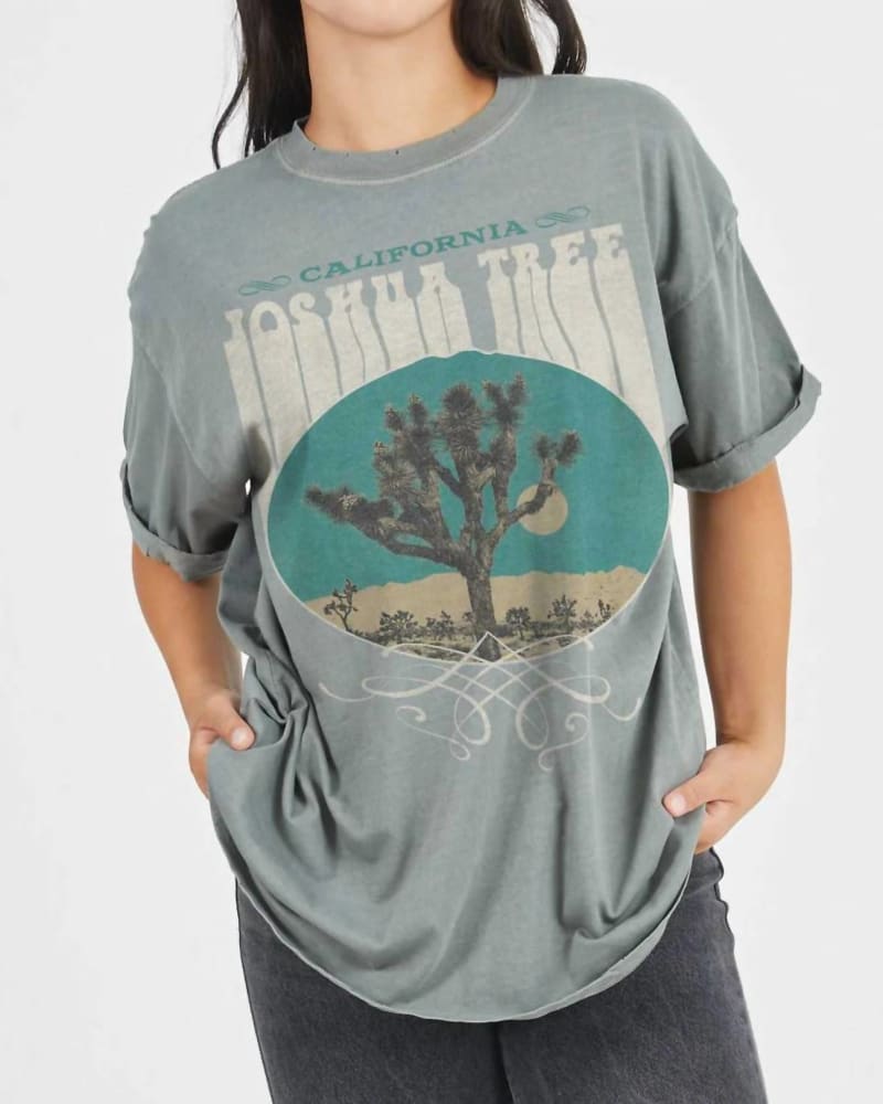 Front of a model wearing a size Large Joshua Tree Western Boyfriend Tee in Army Green in Army Green by Girl Dangerous. | dia_product_style_image_id:333875